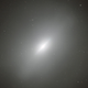 Illustration for article titled The Heart of this Elliptical Galaxy Exposes a Ghost From Its Past